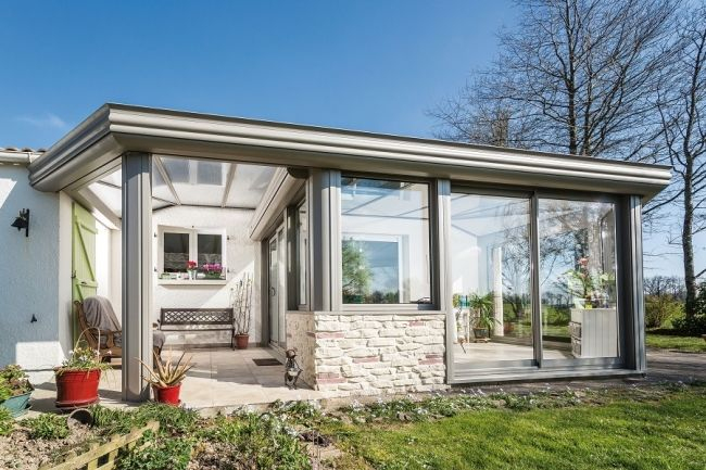 Véranda À Toiture Plate, Une Nouvelle Tendance | Veranda destiné Terrasse Couverte En Dur