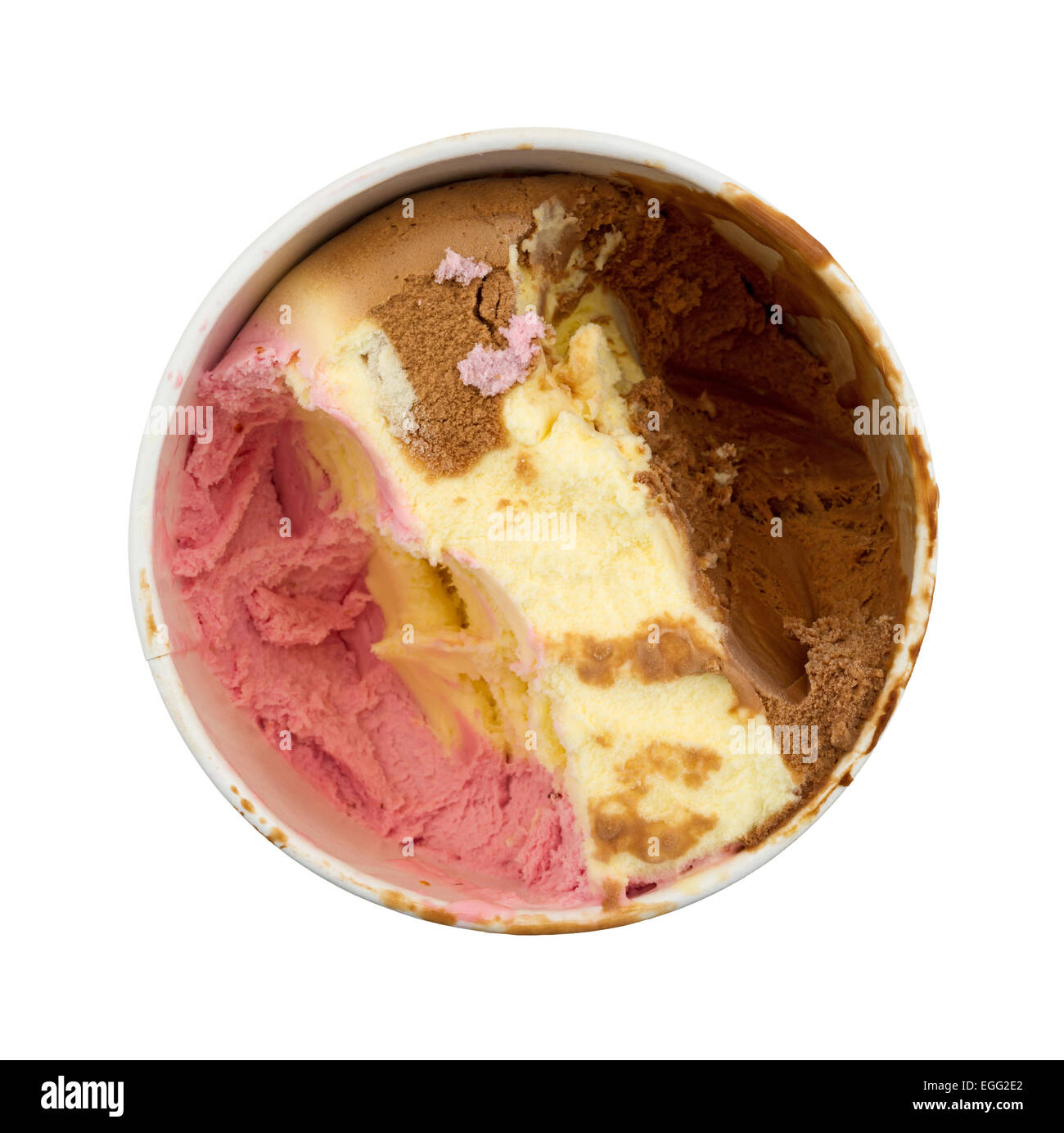 Top view of an opened container of Neapolitan ice cream with some