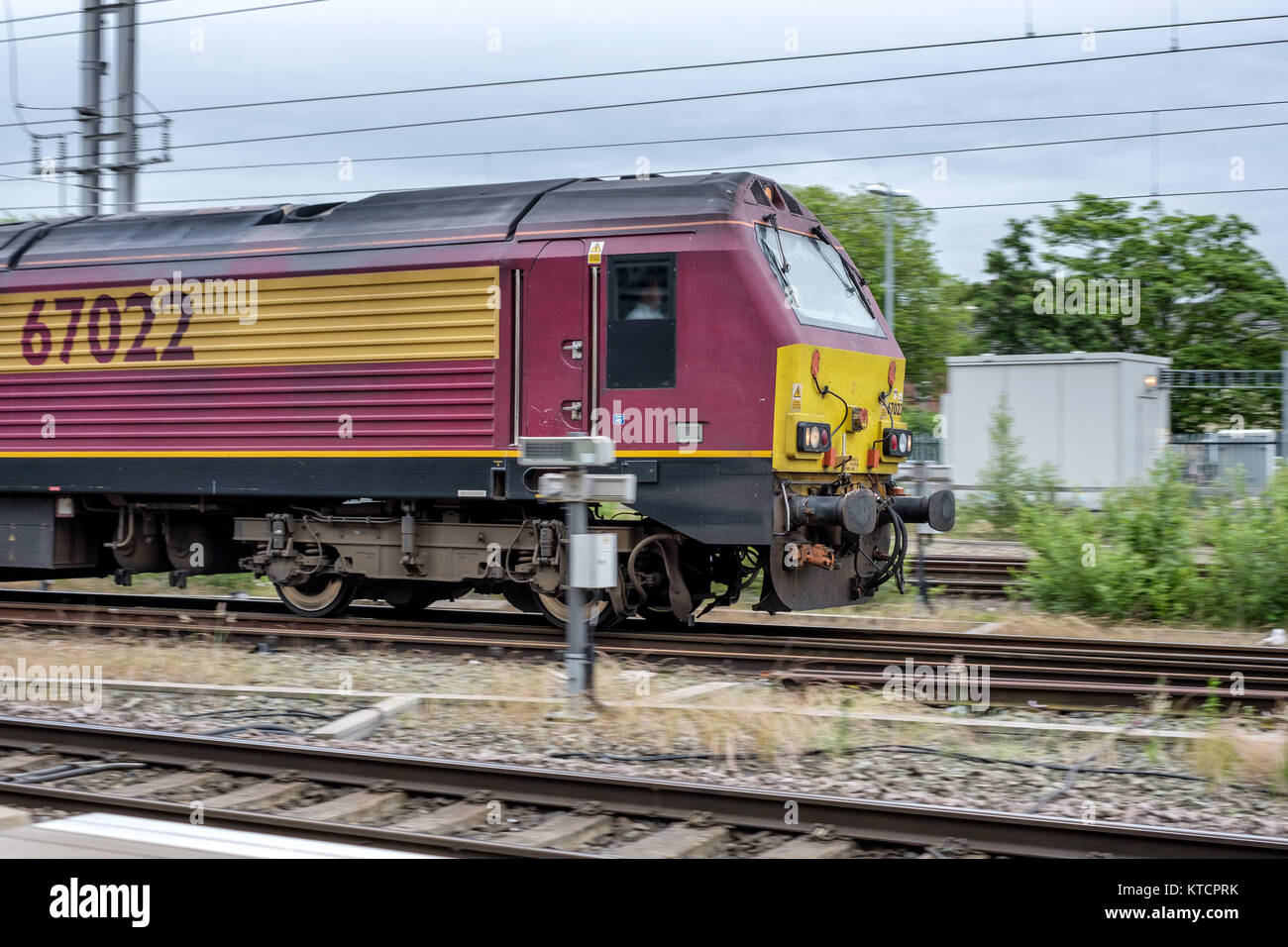 Fast moving train on tracks, captured with motion blur, showcasing