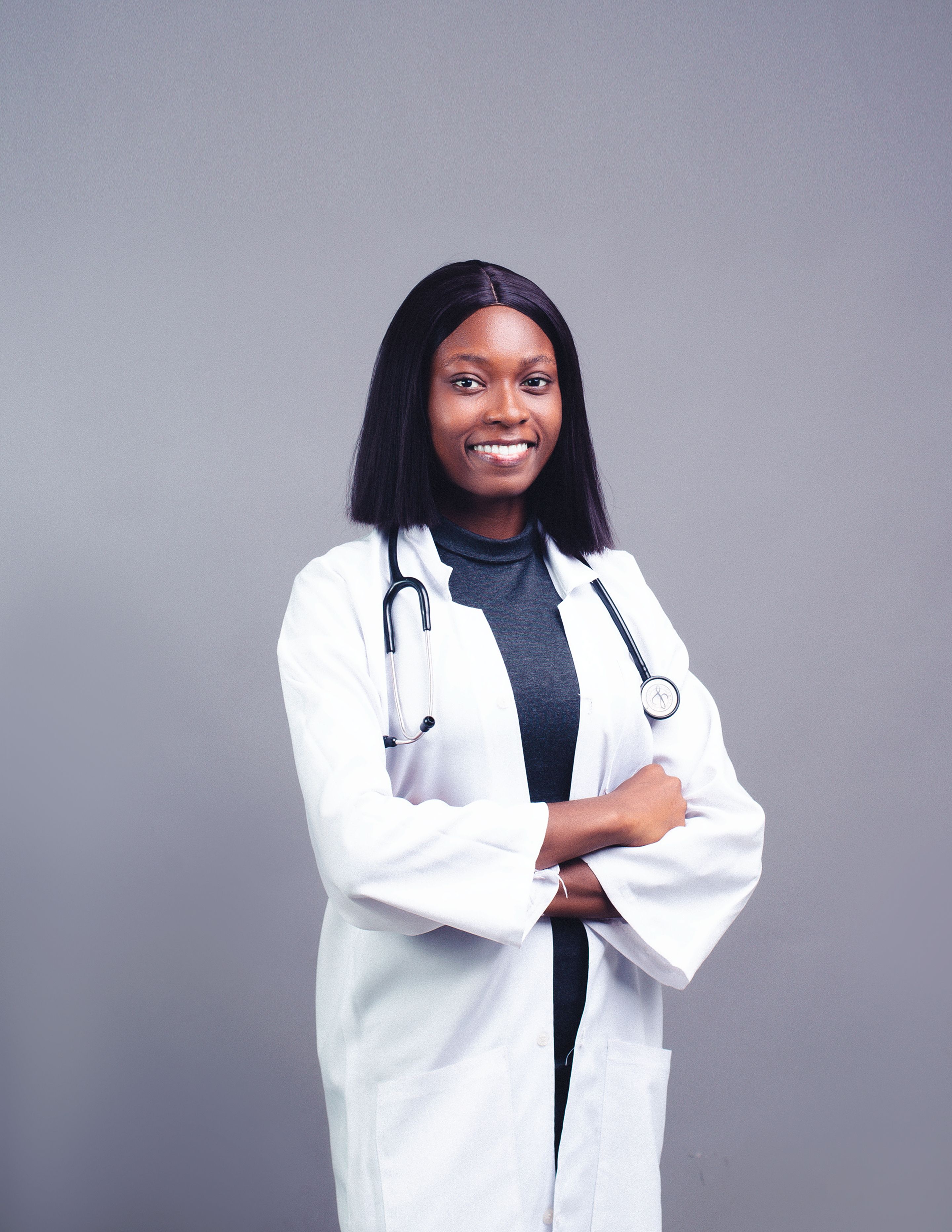 Portrait of Smiling Black Woman Doctor in Medical Robe · Free Stock Photo