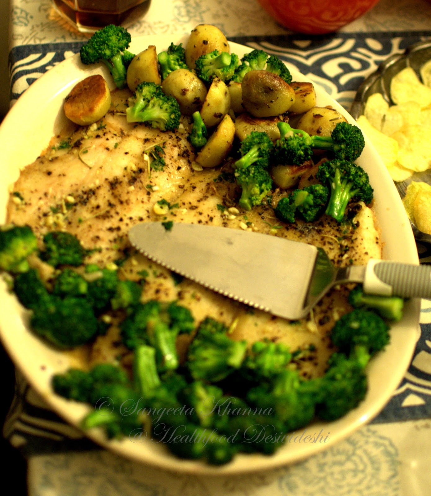 baked fish fillet with a lemon-garlic-parsley-rosemary butter....